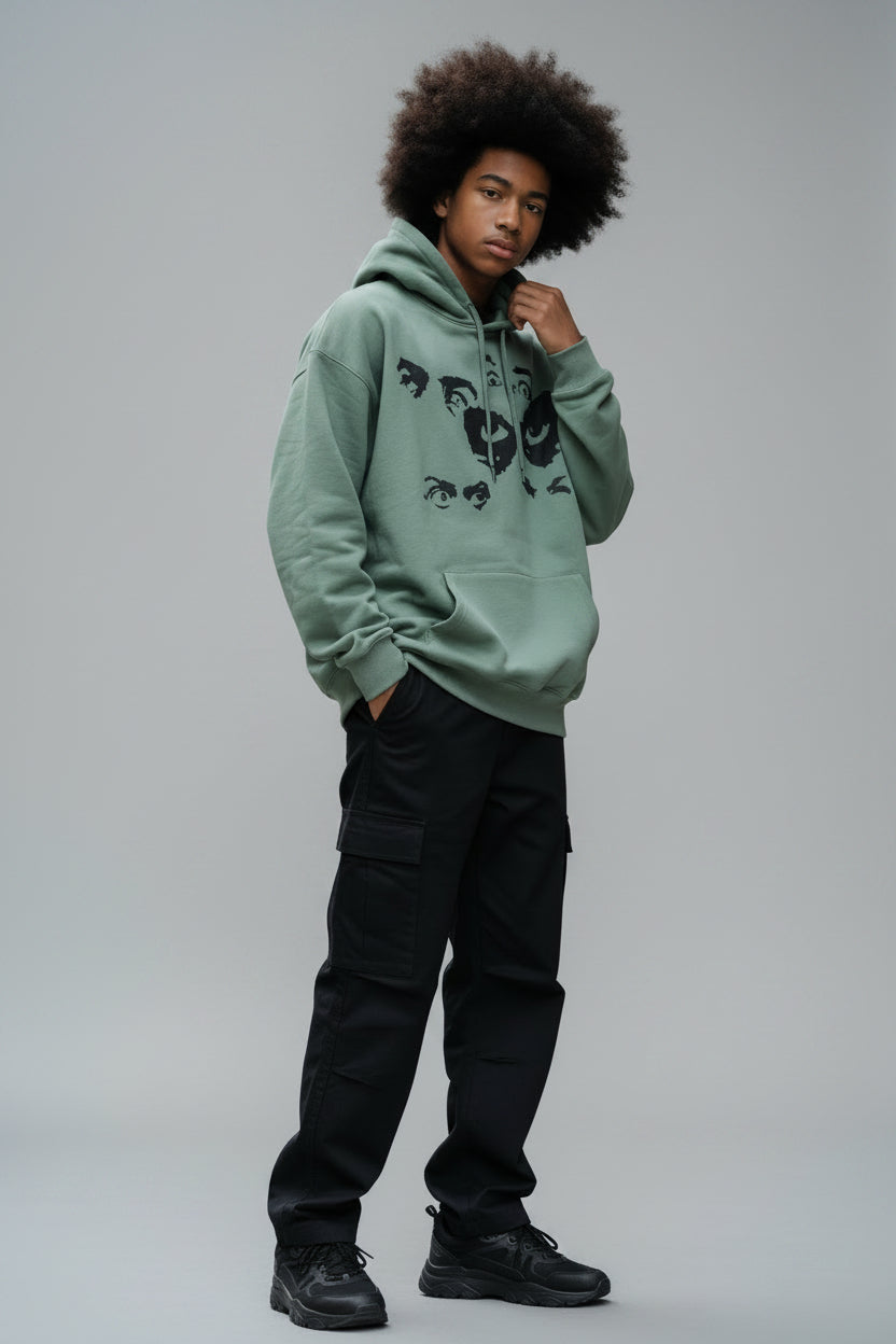 Pull vert avec dessin
