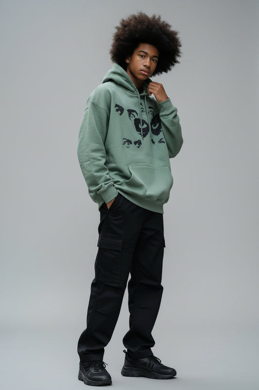 Pull vert avec dessin