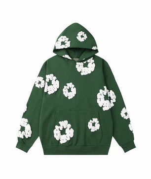 Sweat vert à fleurs blanches