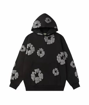 Sweat noir à fleurs blanches